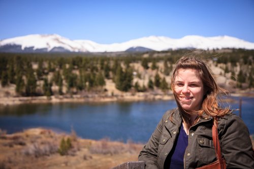 Julia Miller in front of the river and mountains